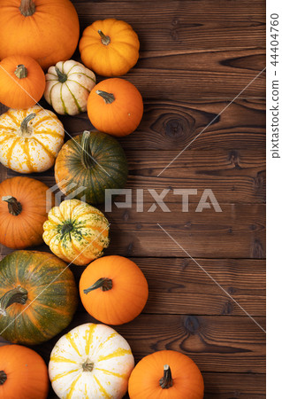 Pumpkins on wooden background 44404760