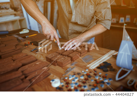 Close-up view on the work of a wood carpenter 44404827