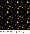 Pattern of many orange eyes of angry faces of pumpkins in darkness. 44405109