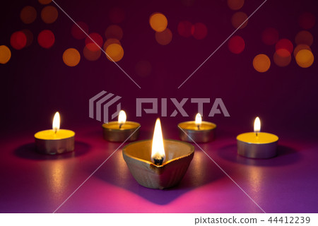 Happy Diwali - Clay Diya lamps lit during Dipavali 44412239