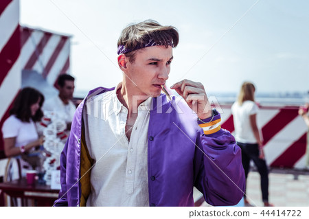 Attentive student being addicted with marijuana cigarette Attentive student being addicted with marijuana cigarette 44414722