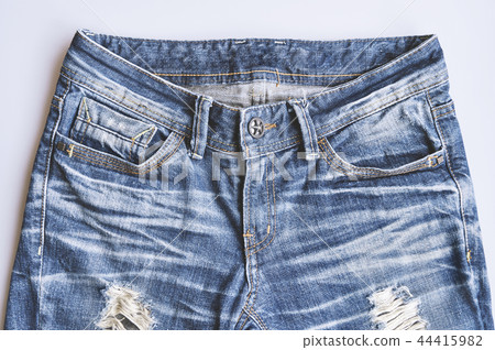 Vintage denim blue jeans texture with crease seam Vintage denim blue jeans texture with crease seam 44415982
