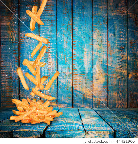 French fries in freeze motion. French fries in freeze motion. 44421900