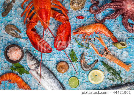 Fresh tasty seafood served on old wooden table. Fresh tasty seafood served on old wooden table. 44421901