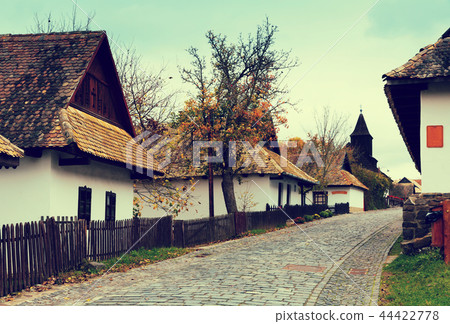 Landscape of Holloko with wooden church Landscape of Holloko with wooden church 44422778