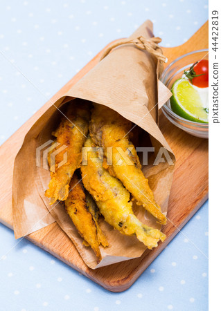 Deep fried anchovies with creamy cheese sauce Deep fried anchovies with creamy cheese sauce 44422819