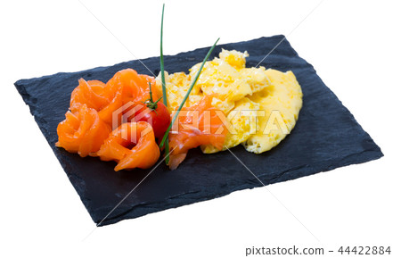 Traditional dish of Norwegian cuisine of omelet with salmon at plate Traditional dish of Norwegian cuisine of omelet with salmon at plate 44422884