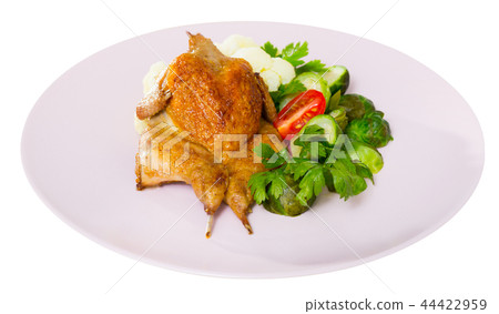 Tobacco quail with steamed vegetables. Isolated over white backg 44422959