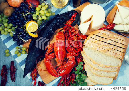 Still life with cooking seafood products, wine and cheese Still life with cooking seafood products, wine and cheese 44423268