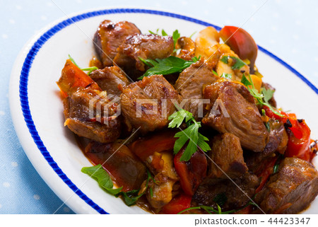Stewed meat with vegetables and mushrooms 44423347
