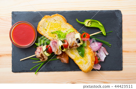 Mutton slices on barbecue skewers Mutton slices on barbecue skewers 44423511
