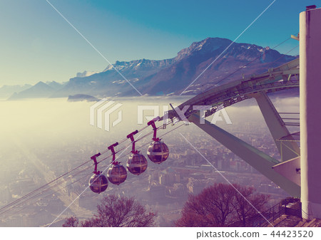 Cityscape with cable cars in Grenoble in autumn, France Cityscape with cable cars in Grenoble in autumn, France 44423520