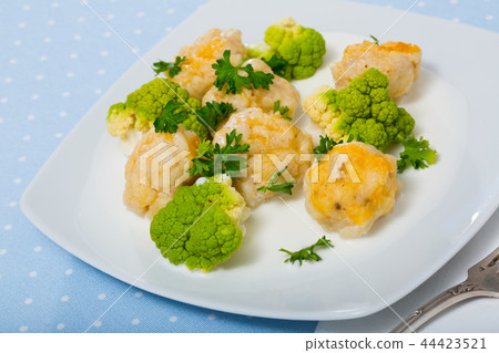 Fish balls with white sauce, broccoli, greens Fish balls with white sauce, broccoli, greens 44423521