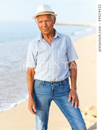 Positive mature man in headwear posing Positive mature man in headwear posing 44424432