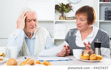 Aged couple struggling to pay bills 44425637
