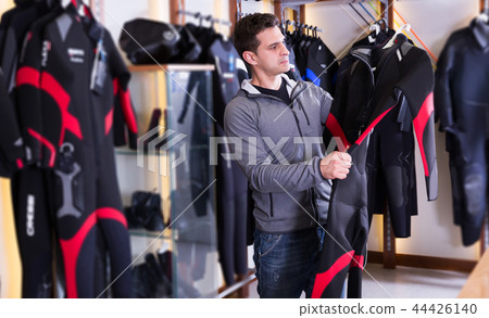 Male is standing with costume for diving 44426140