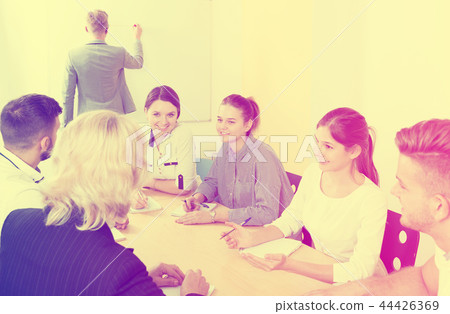 positive students working together in auditorium positive students working together in auditorium 44426369