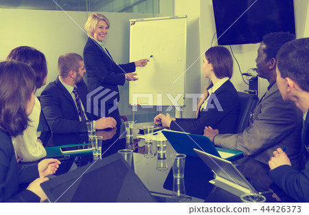 Businesswoman doing presentation to colleagues Businesswoman doing presentation to colleagues 44426373