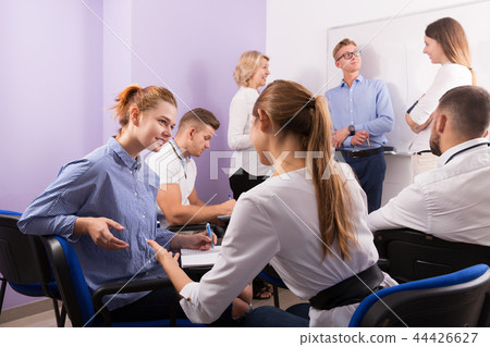 students talking with teacher and with each other