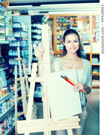 woman shopping wooden easel 44426663