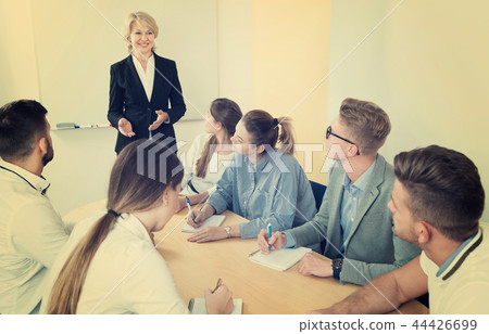 Group of students and professor working together 44426699