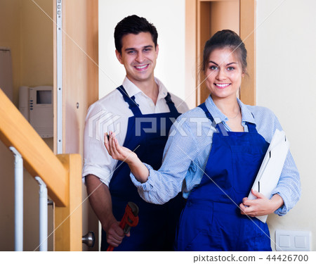 handyman and assistant in uniform handyman and assistant in uniform 44426700