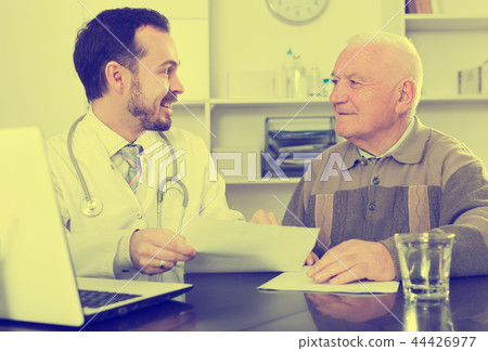 Old man visits doctor Old man visits doctor 44426977