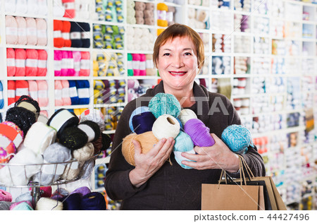 Female client is standing with shopping bags. Female client is standing with shopping bags. 44427496