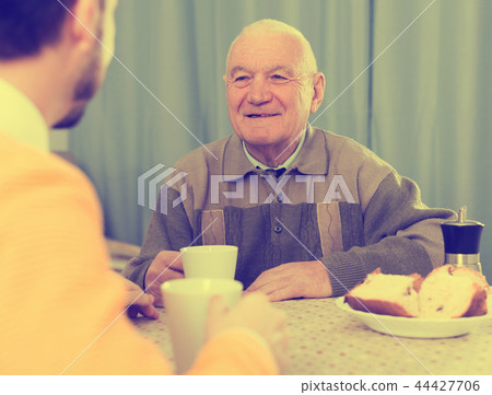 Father and son enjoying evening Father and son enjoying evening 44427706
