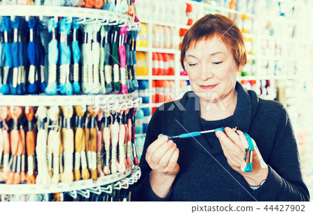 Woman buying mouline Woman buying mouline 44427902