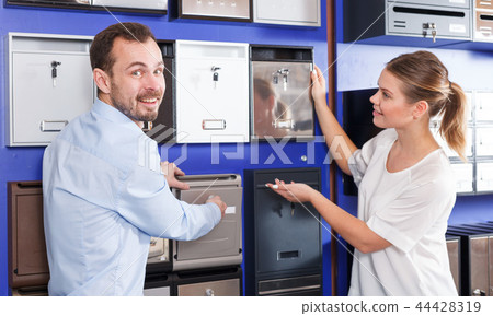 Couple choosing mailbox 44428319