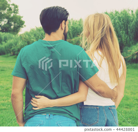 Smiling couple is walking together Smiling couple is walking together 44428801