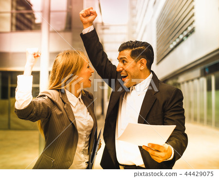 Businessman and his boss woman are signed successful contract 44429075