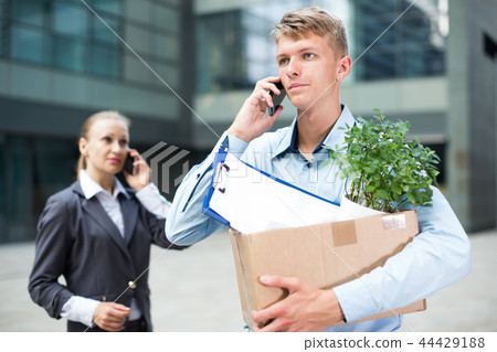 Office worker is talking phone about the new job Office worker is talking phone about the new job 44429188