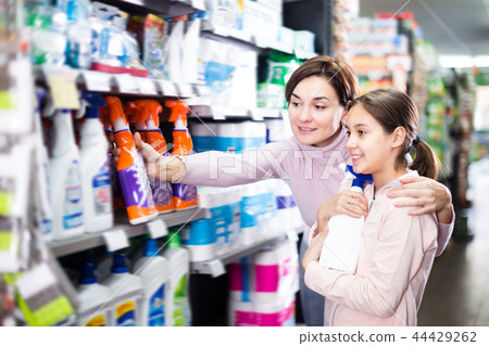 Adult woman with daughter choosing best cleaners 44429262