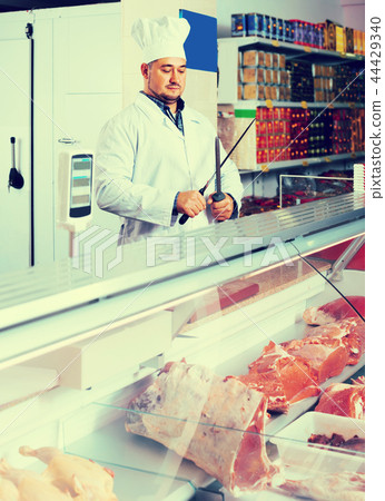 Portrait of male butcher in kosher section at supermarket 44429340