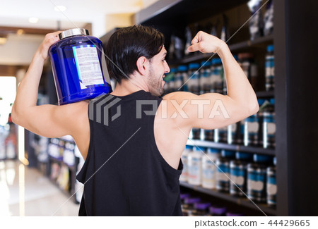 athletic man holding on shoulder sport food products athletic man holding on shoulder sport food products 44429665