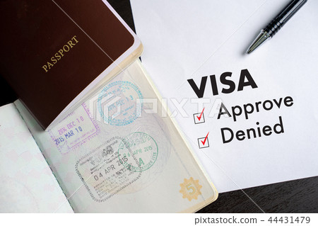 Visa and passport to approved stamped on a 44431479