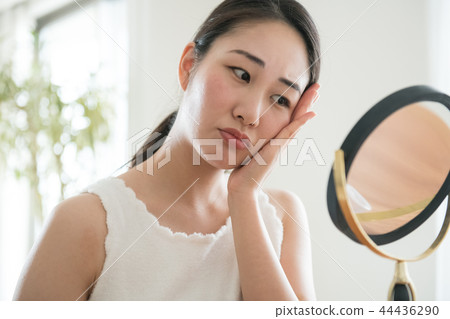 Young Japanese woman beauty suffering from rough skin Young Japanese woman beauty suffering from rough skin 44436290