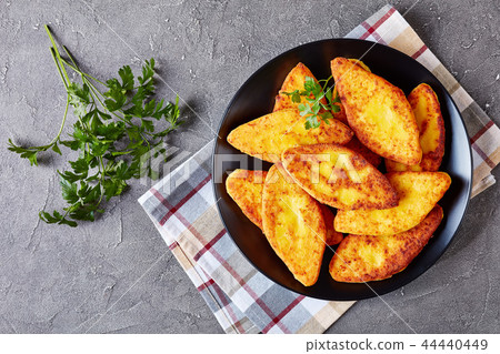 fried cornbread pancakes on a plate 44440449