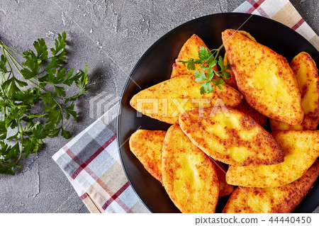 Chvishtari served on a black plate 44440450