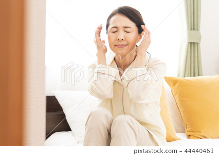 Woman suffering from headache Woman suffering from headache 44440461
