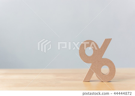Percentage sign symbol icon wooden on wood table Percentage sign symbol icon wooden on wood table 44444872