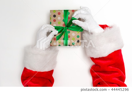 Santa making a Christmas gift 44445296
