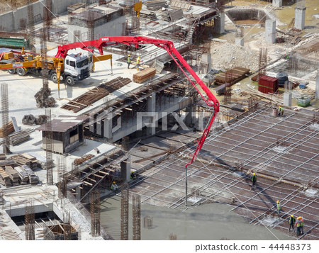 Concreting work by construction workers Concreting work by construction workers 44448373