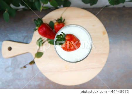 yogurt with strawberry topping 44448975