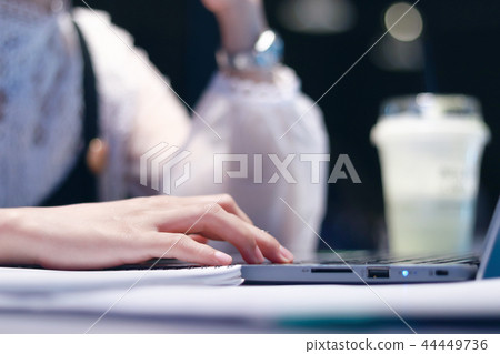 Women are working on computers middle of the nigh Women are working on computers middle of the nigh 44449736