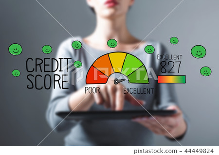 Excellent credit score with woman using a tablet 44449824