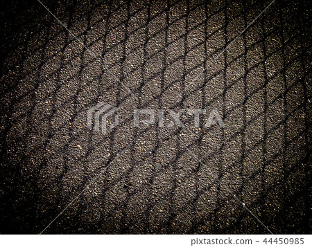 Shadow from mesh fencing on asphalt with frame 44450985