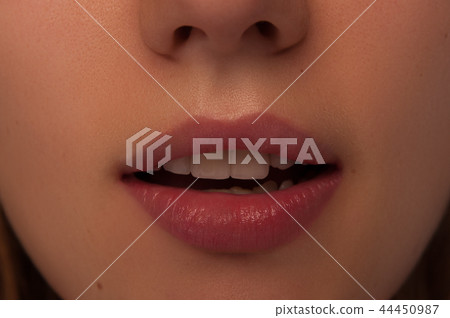 Closeup of young female open mouth Closeup of young female open mouth 44450987